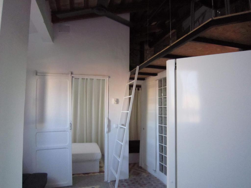 a room with a ladder and a bunk bed at Young Penthouse in Valencia