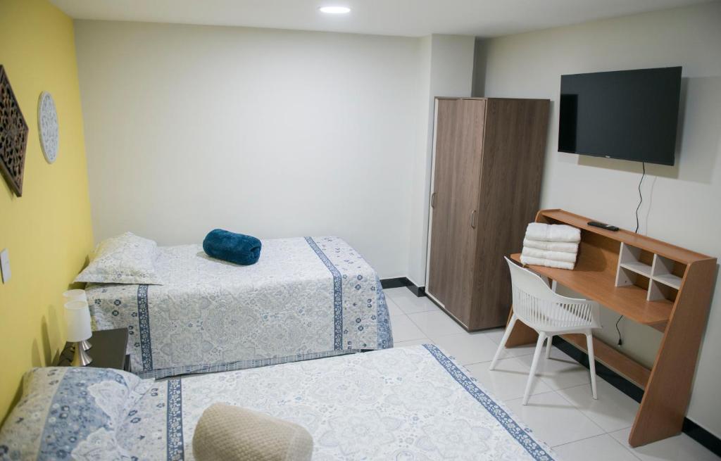 Postel nebo postele na pokoji v ubytování Casa Tangara Café y Hospedaje