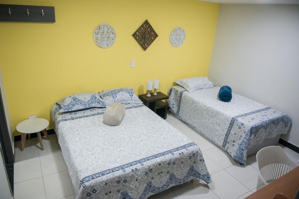 Postel nebo postele na pokoji v ubytování Casa Tangara Café y Hospedaje