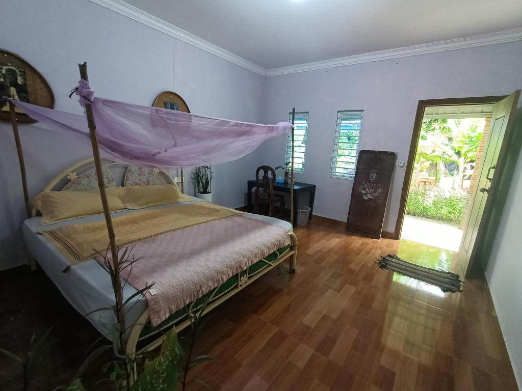 Postel nebo postele na pokoji v ubytování Phonluer Angkor Homestay,