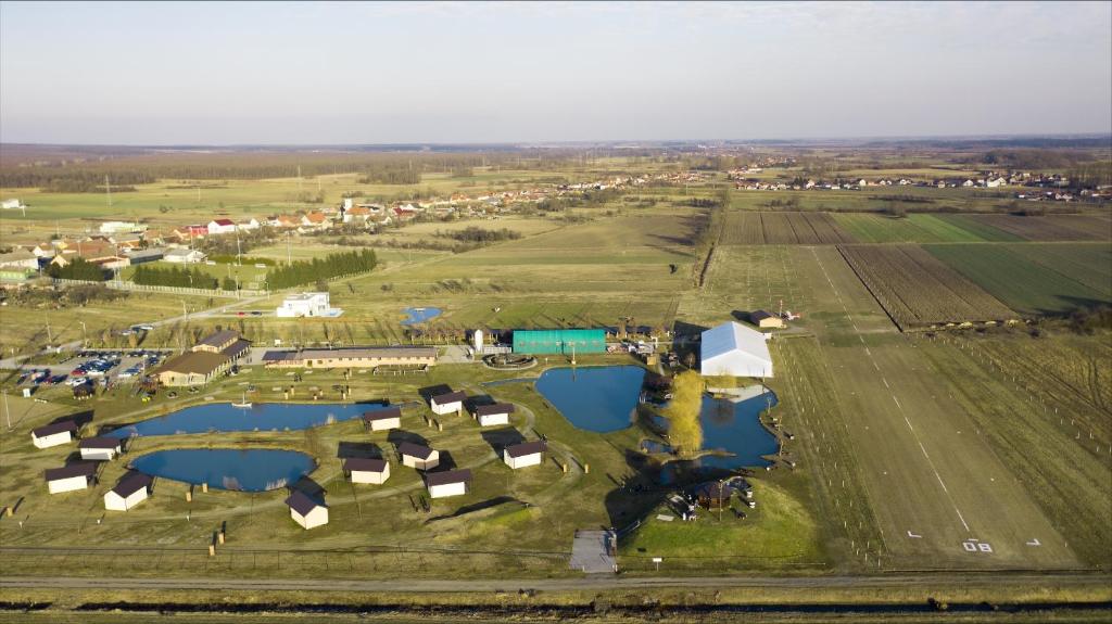 an aerial view of a farm with two reservoirs at Rooms with a parking space Slavonski Brod, Slavonija - 19326 in Garčin