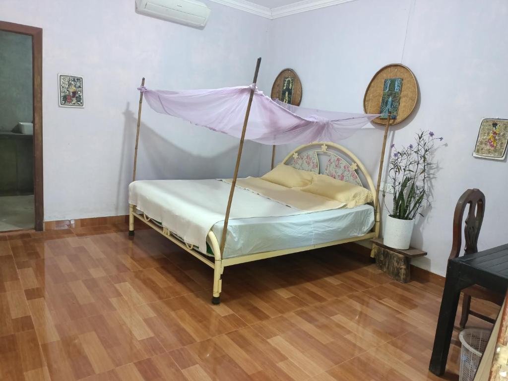 Postel nebo postele na pokoji v ubytování Phonluer Angkor Homestay,