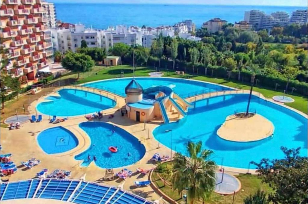 an image of a large swimming pool in a resort at Mediterránean & Sun in Minerva, Benalmádena in Benalmádena