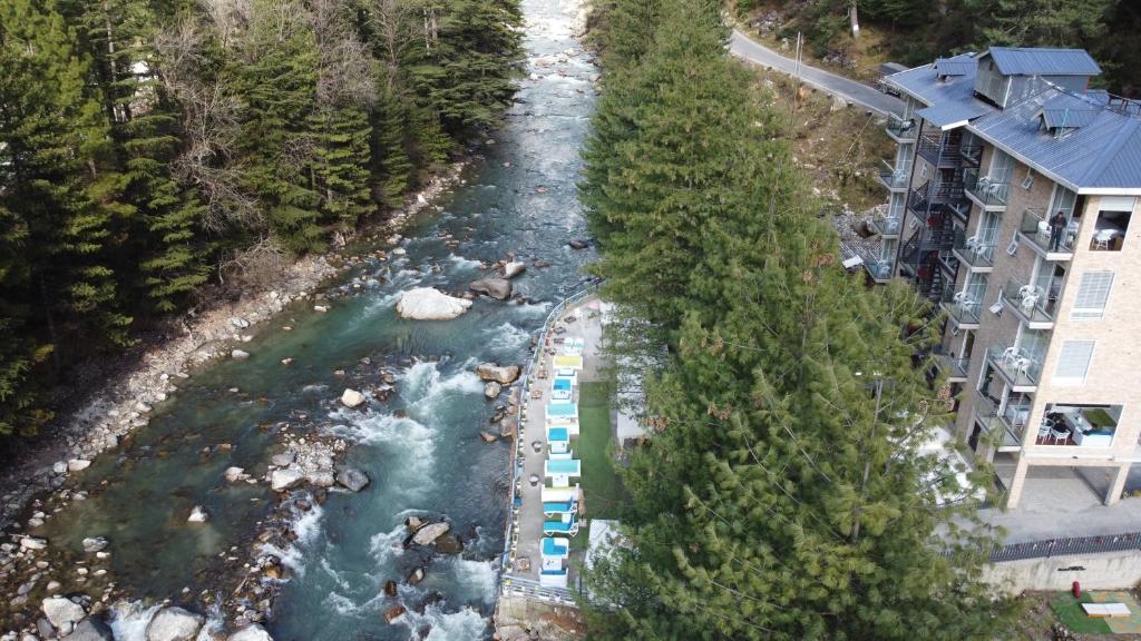 an aerial view of a river with rapids at Moksha Riverside Resort in Kasol