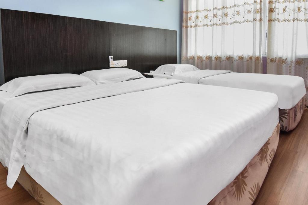 Postel nebo postele na pokoji v ubytování Hotel Hsiang Garden