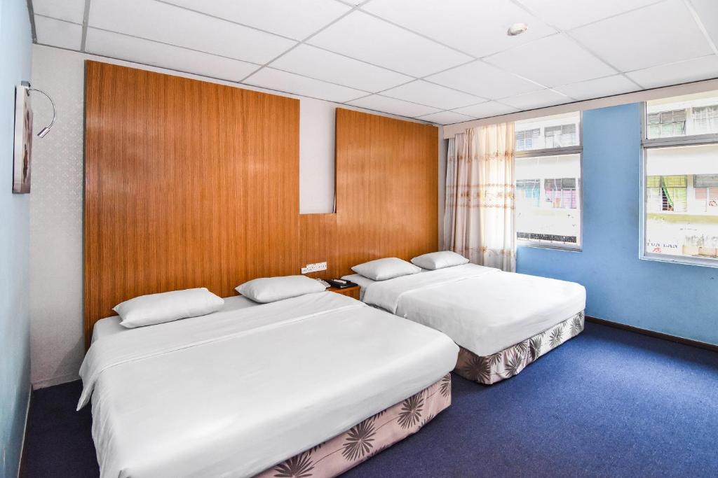 Postel nebo postele na pokoji v ubytování Hotel Hsiang Garden