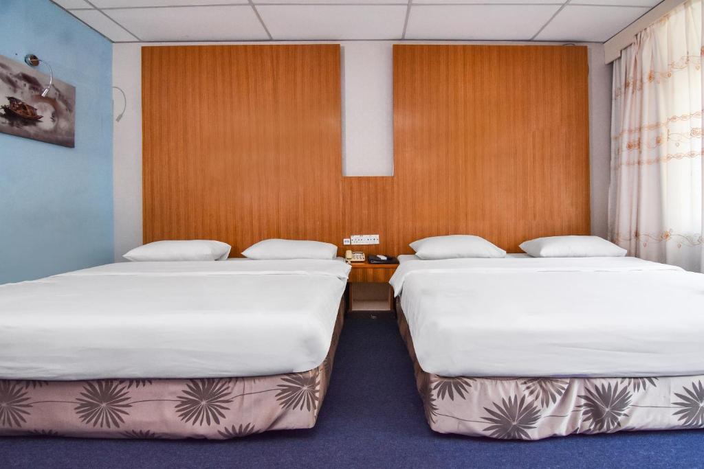 Postel nebo postele na pokoji v ubytování Hotel Hsiang Garden