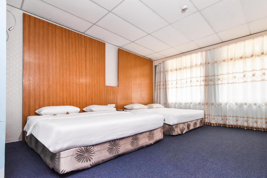 Postel nebo postele na pokoji v ubytování Hotel Hsiang Garden