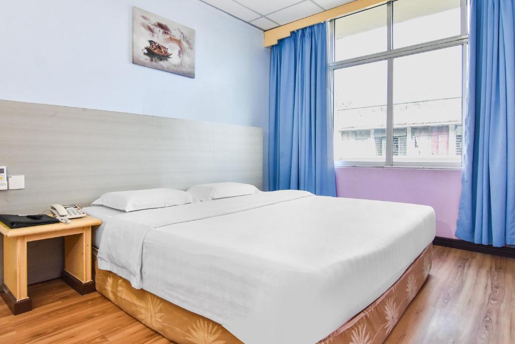 Postel nebo postele na pokoji v ubytování Hotel Hsiang Garden