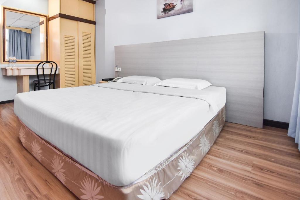 Postel nebo postele na pokoji v ubytování Hotel Hsiang Garden