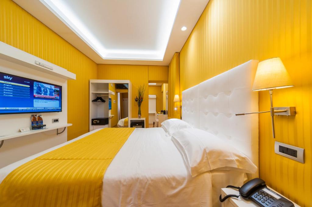 Postel nebo postele na pokoji v ubytování Trevi 41 Hotel