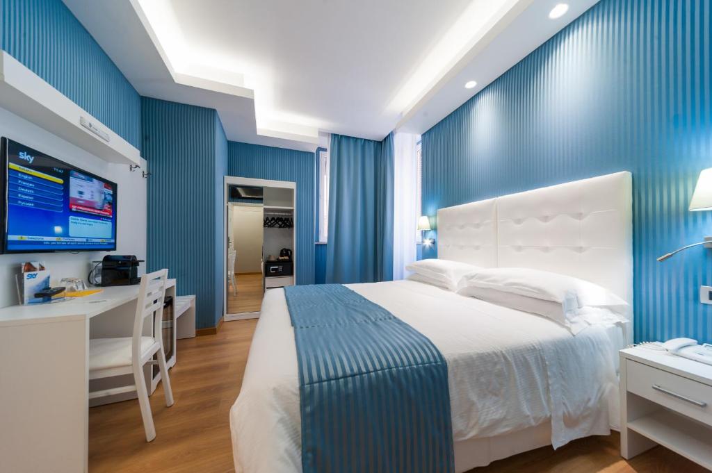 Postel nebo postele na pokoji v ubytování Trevi 41 Hotel