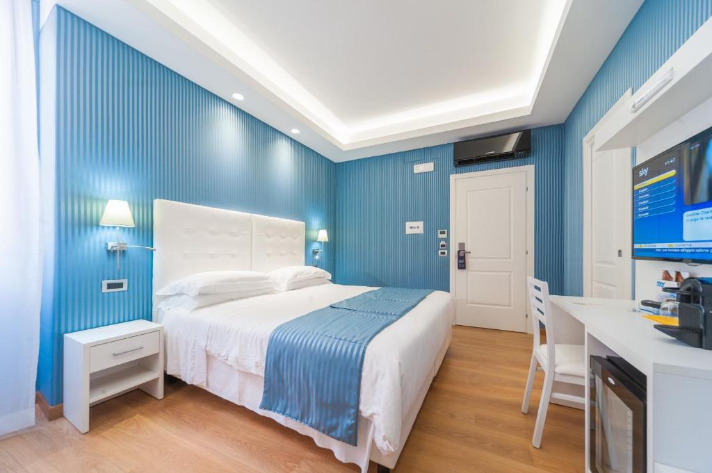 Postel nebo postele na pokoji v ubytování Trevi 41 Hotel