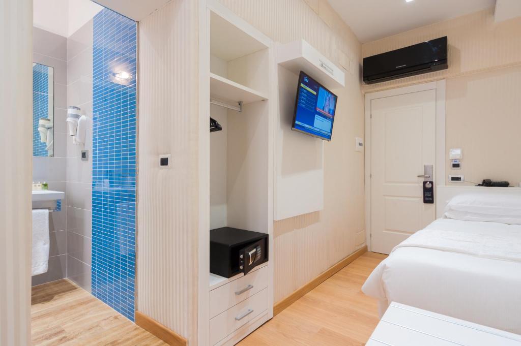 Postel nebo postele na pokoji v ubytování Trevi 41 Hotel