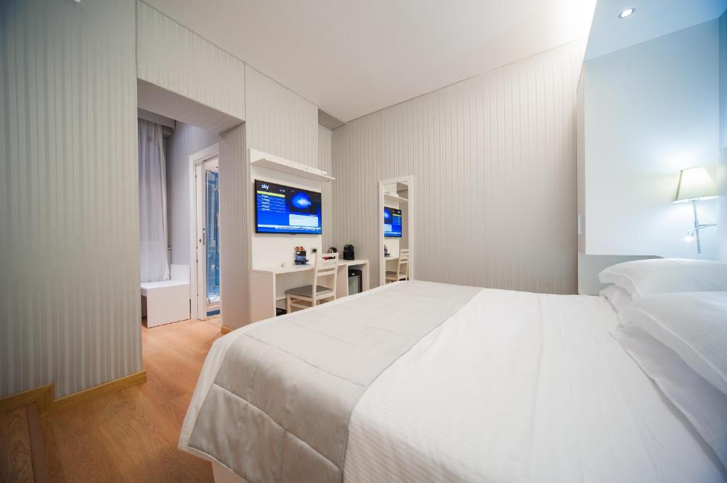 Postel nebo postele na pokoji v ubytování Trevi 41 Hotel