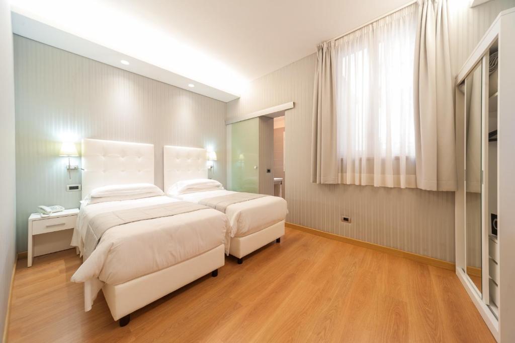Postel nebo postele na pokoji v ubytování Trevi 41 Hotel