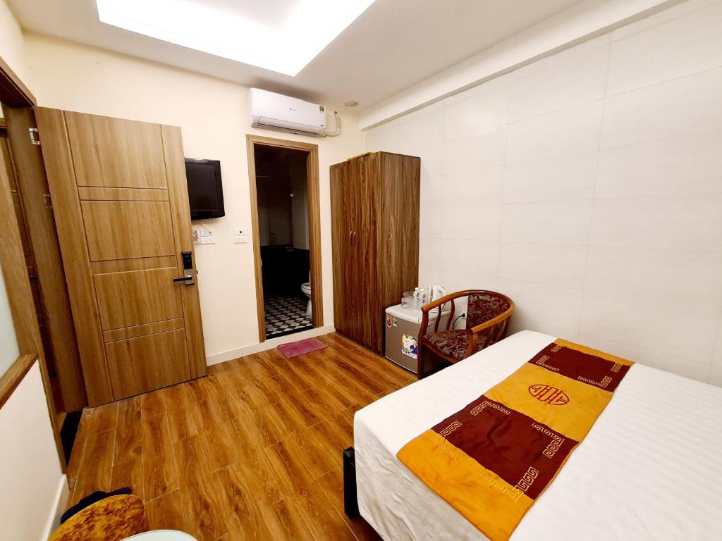 Postel nebo postele na pokoji v ubytování Urban Alley Hotel