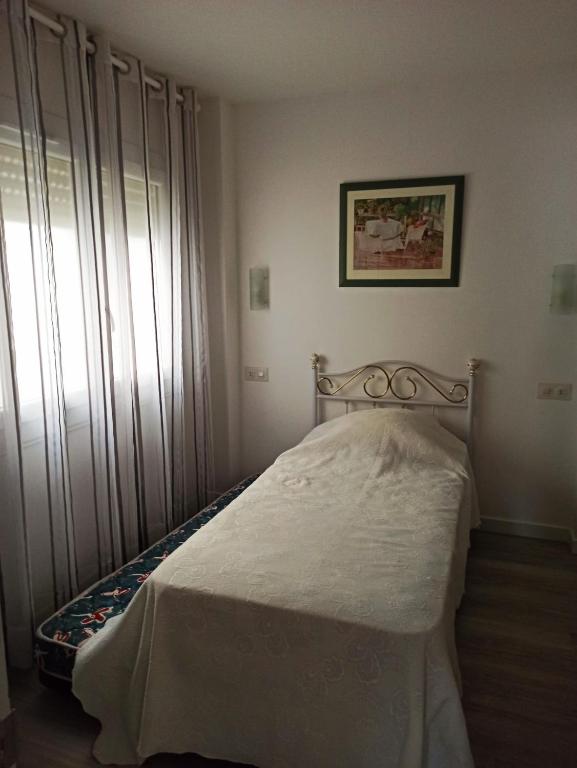 A bed or beds in a room at Palamos Carrer Del Mar