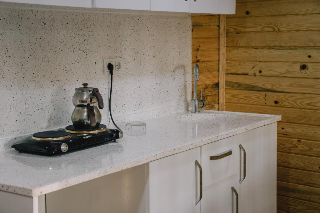 a tea kettle on a counter in a kitchen at Ağva Marina House in Istanbul