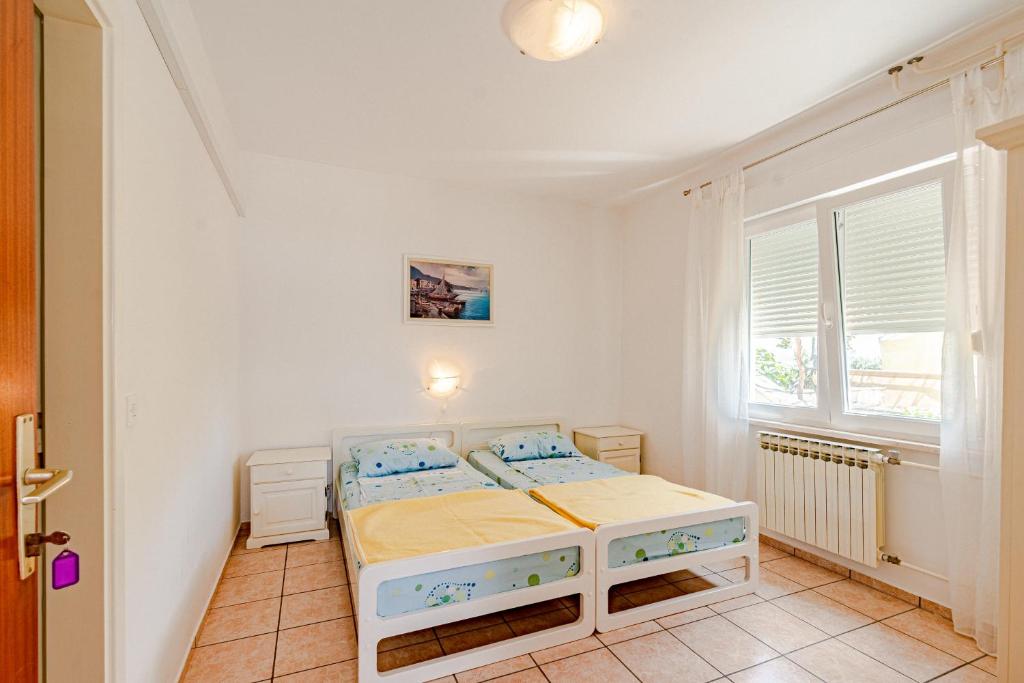 Postel nebo postele na pokoji v ubytování Apartments by the sea Viganj, Peljesac - 19391