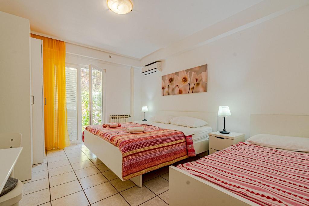 Postel nebo postele na pokoji v ubytování Apartments by the sea Viganj, Peljesac - 19391