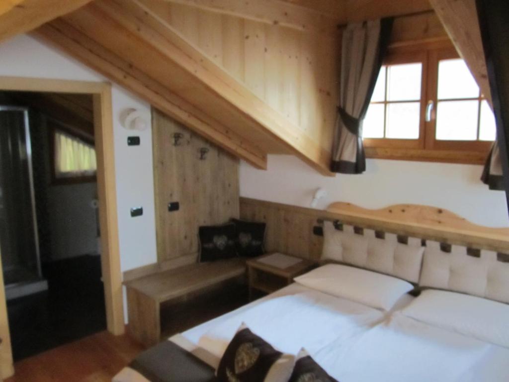 Posteľ alebo postele v izbe v ubytovaní B&B Mas di Zonadi