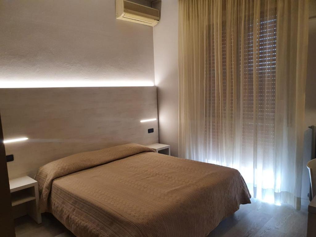 Postel nebo postele na pokoji v ubytování Air Hotel