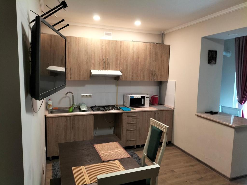 Kuchyň nebo kuchyňský kout v ubytování ALIANCE апартамети в центрі міста.