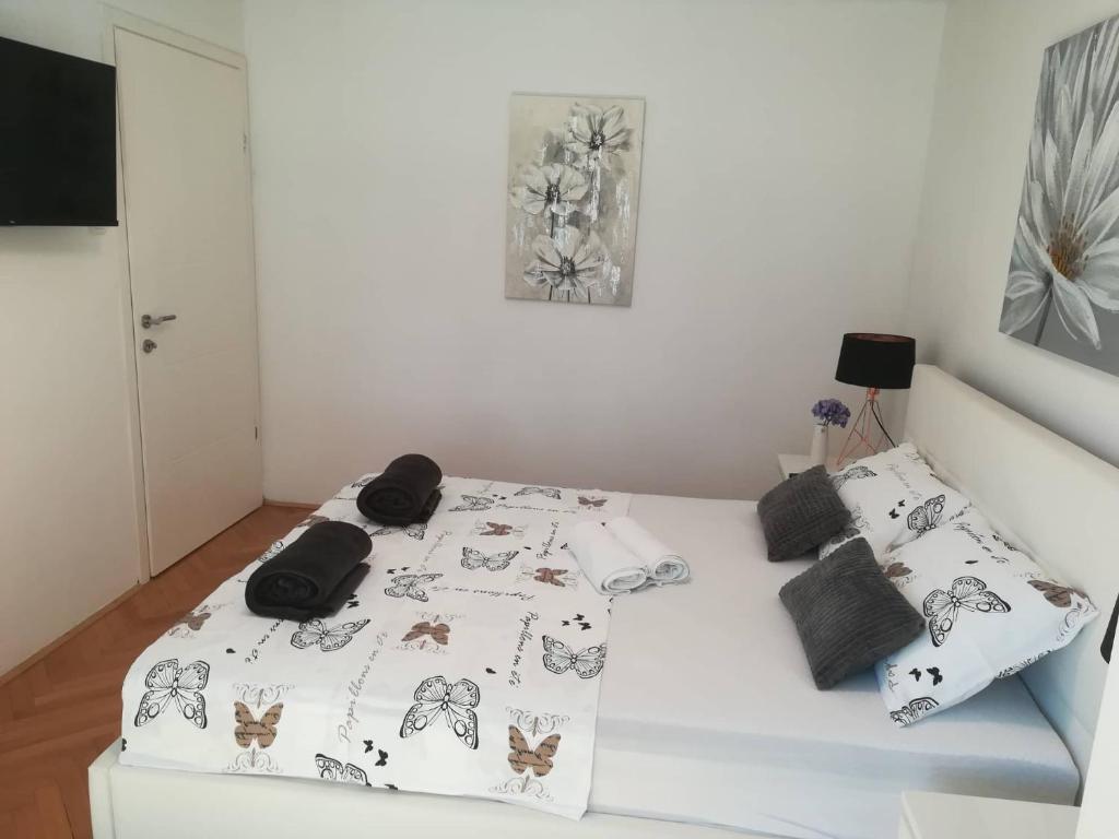 Postel nebo postele na pokoji v ubytování APARTMAN D&D***