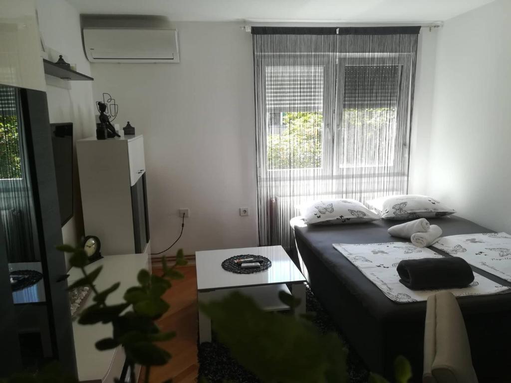 Postel nebo postele na pokoji v ubytování APARTMAN D&D***