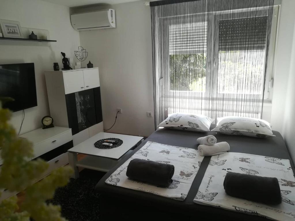 Postel nebo postele na pokoji v ubytování APARTMAN D&D***