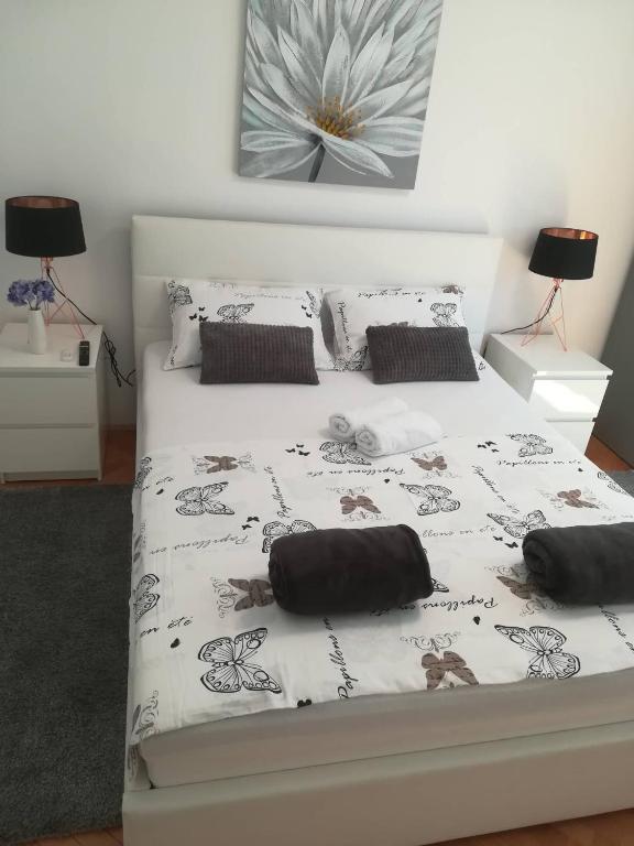 Postel nebo postele na pokoji v ubytování APARTMAN D&D***