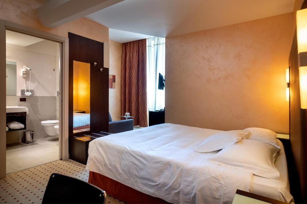 Posteľ alebo postele v izbe v ubytovaní Hotel La Cartiera