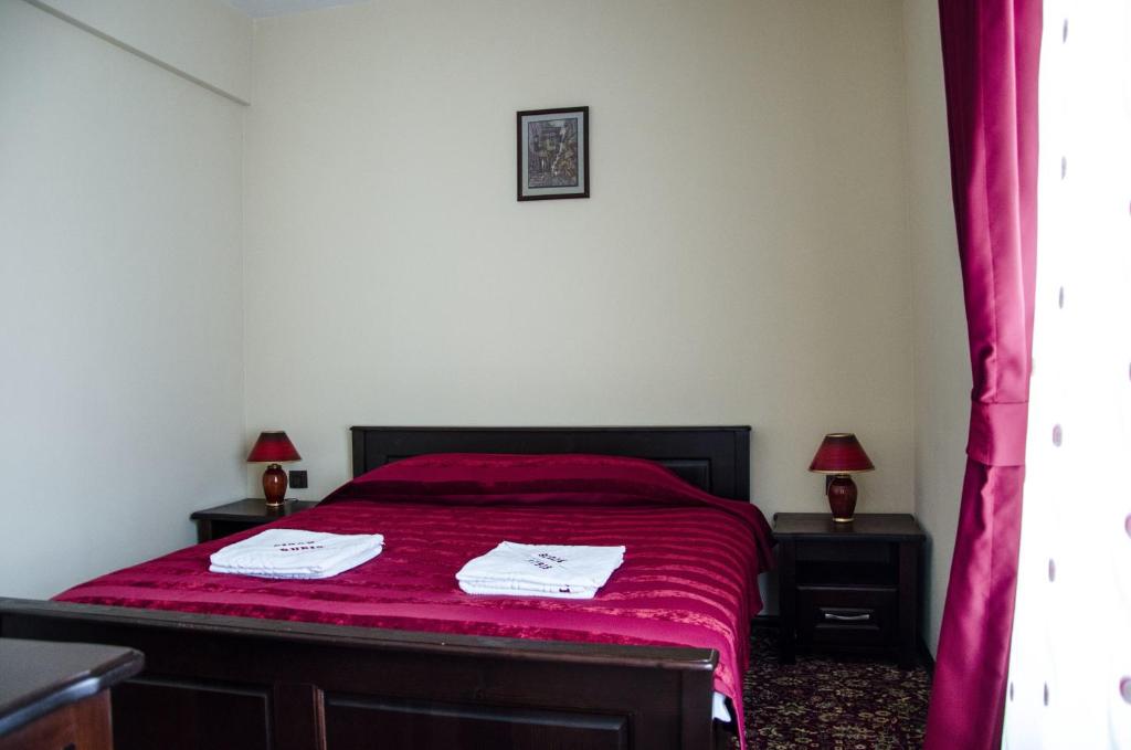 Postel nebo postele na pokoji v ubytování Rubis Hotel