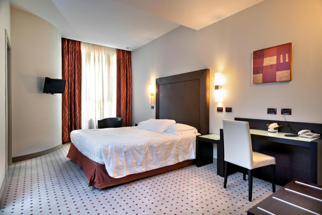 Posteľ alebo postele v izbe v ubytovaní Hotel La Cartiera
