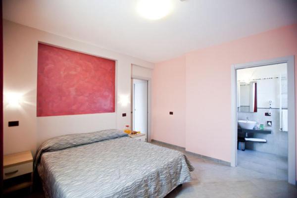 Posteľ alebo postele v izbe v ubytovaní Hotel La Cartiera