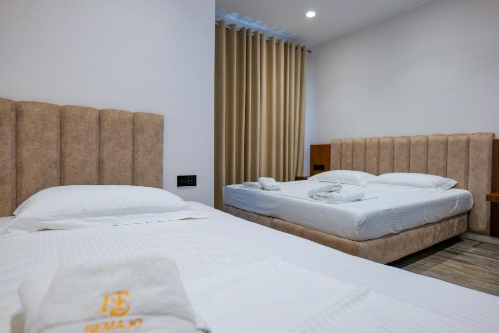 Postel nebo postele na pokoji v ubytování Hotel Semajo