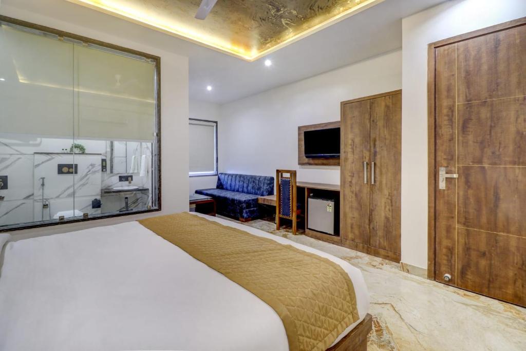 Postel nebo postele na pokoji v ubytování Hotel Anand Villa
