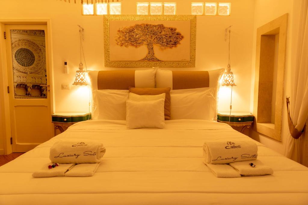 Postel nebo postele na pokoji v ubytování Cadelli Luxury Suite & Apartments