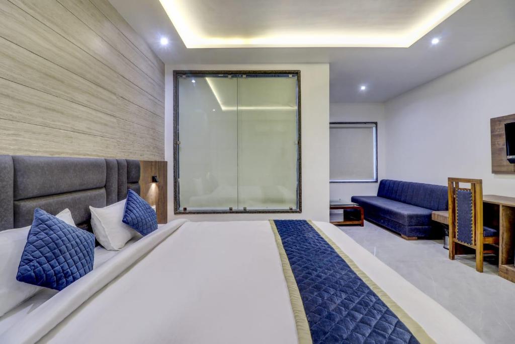Postel nebo postele na pokoji v ubytování Hotel Anand Villa