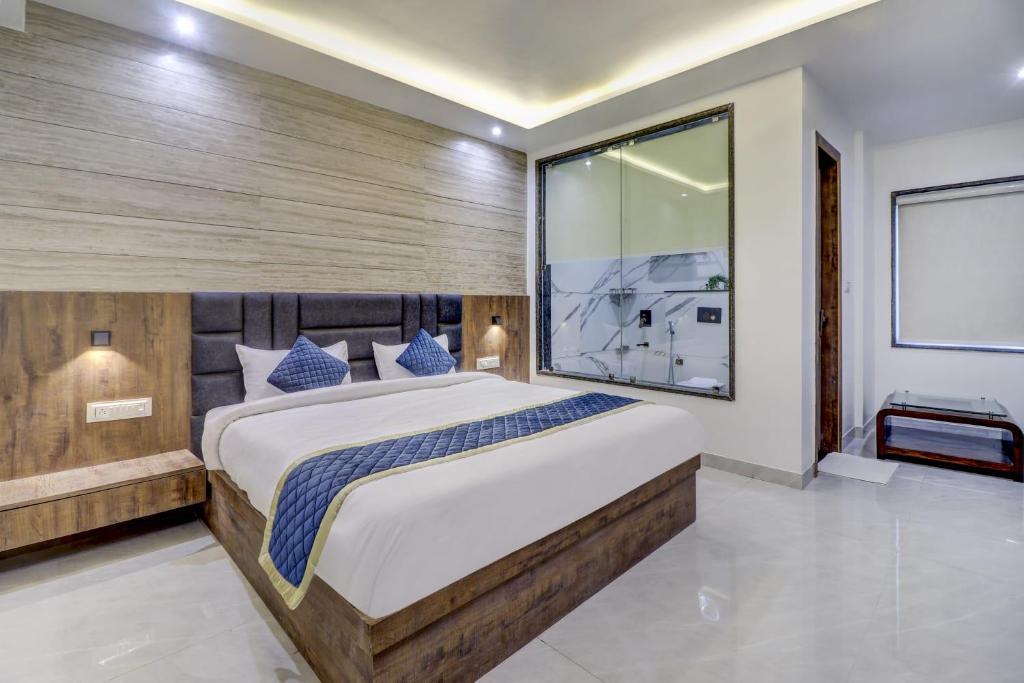 Postel nebo postele na pokoji v ubytování Hotel Anand Villa