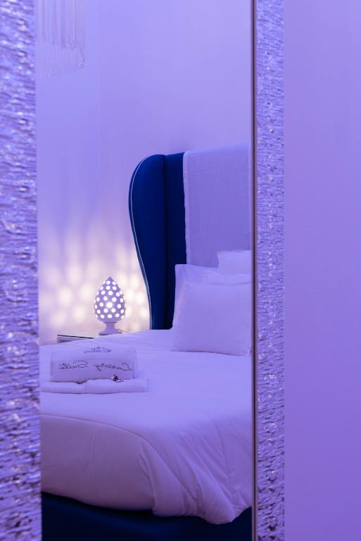 Postel nebo postele na pokoji v ubytování Cadelli Luxury Suite & Apartments