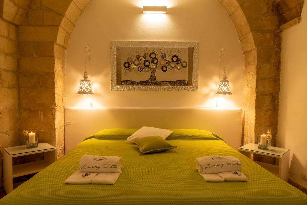 Postel nebo postele na pokoji v ubytování Cadelli Luxury Suite & Apartments