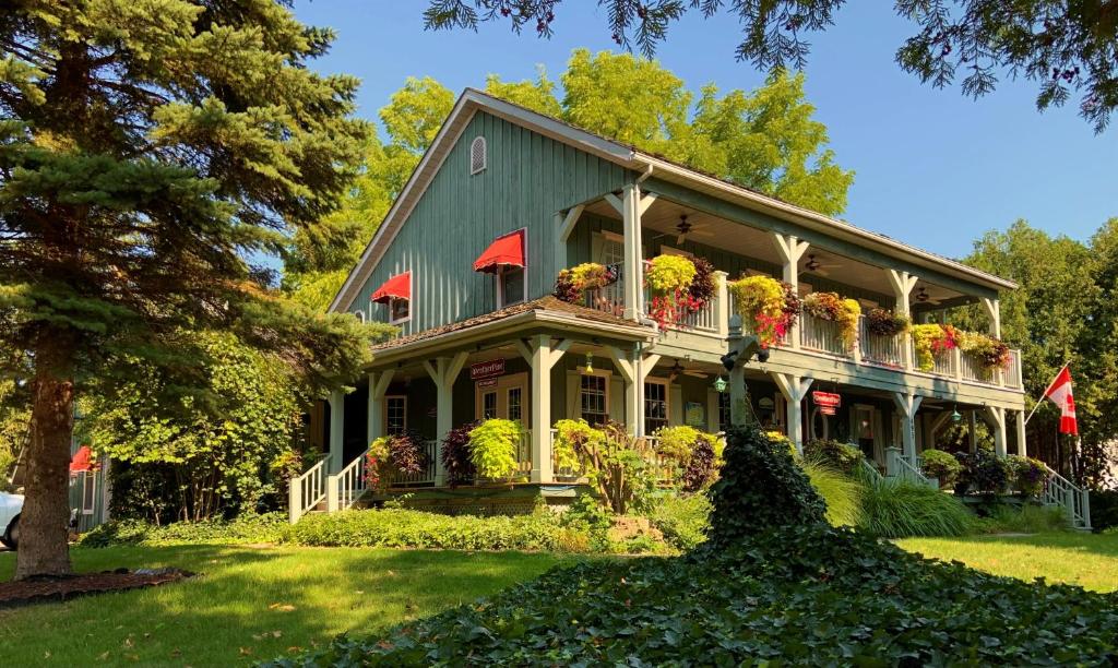 a house with flower boxes on the front of it at WeatherPine Inn in Niagara-on-the-Lake