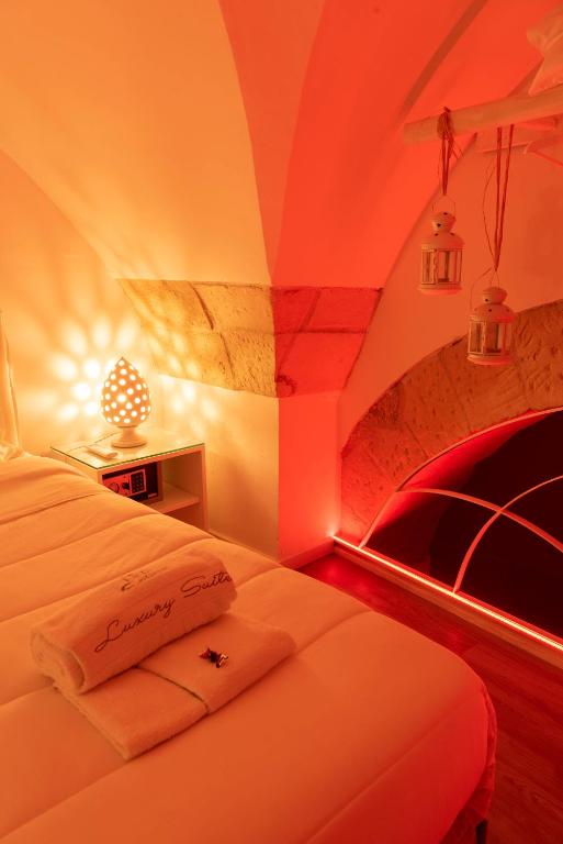 Postel nebo postele na pokoji v ubytování Cadelli Luxury Suite & Apartments