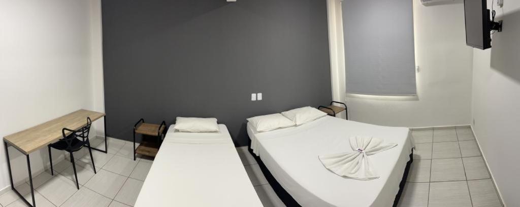 Tempat tidur dalam kamar di Bravo City Hotel São Jose do Rio Preto Ltda