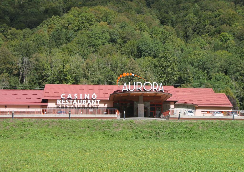 a building with a sign on the front of it at Mike's Rooms in Kobarid