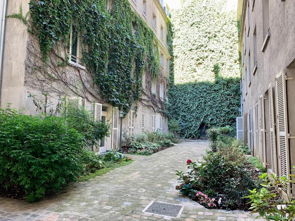 Vonkajšia záhrada v ubytovaní Chambre d’hôtes - Marais