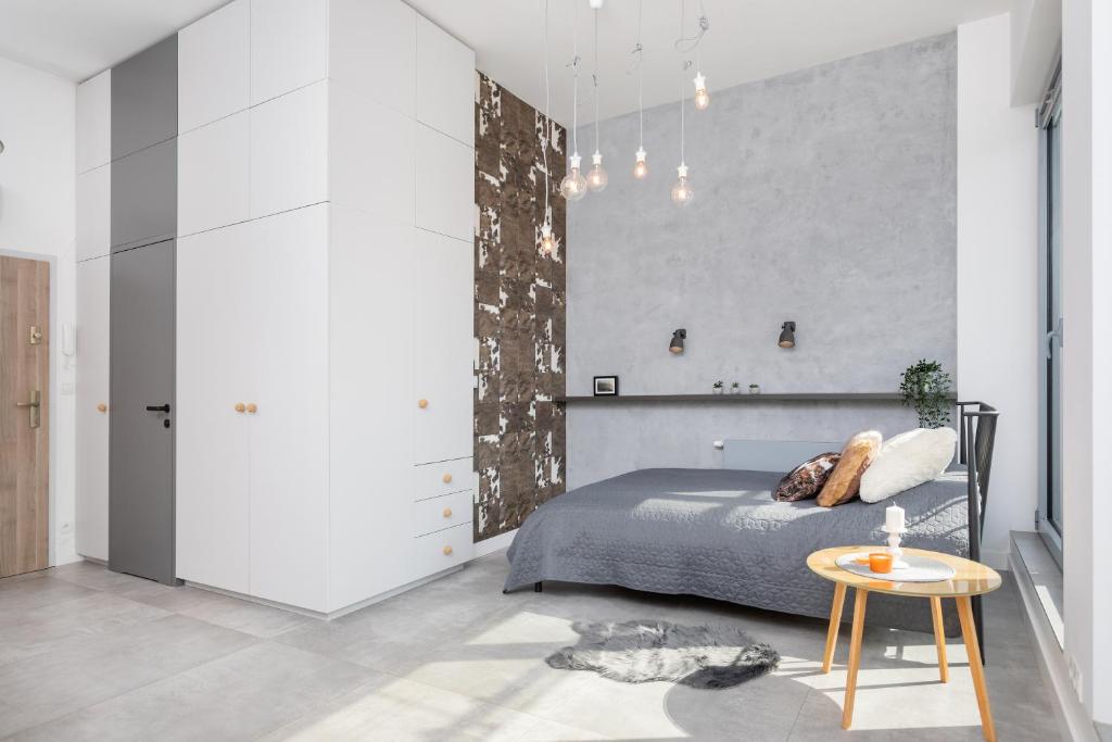 Posteľ alebo postele v izbe v ubytovaní Kraków Loft