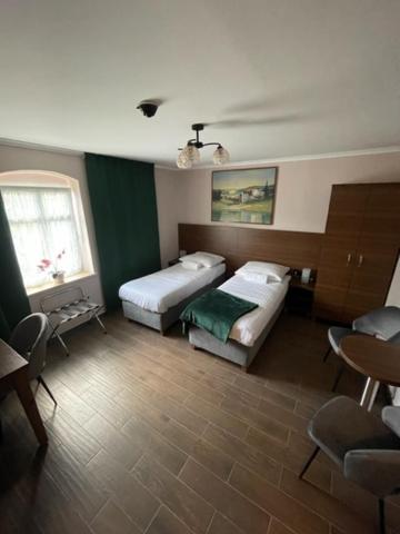 Postel nebo postele na pokoji v ubytování Agroturystyka Siekierczyn 249 - Lubań 7 km, Zgorzelec 15 km